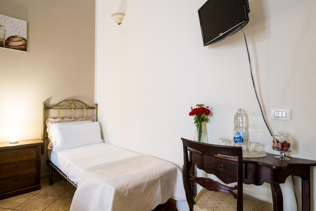 Un ou plusieurs lits dans un hébergement de l'établissement B&B Addauru