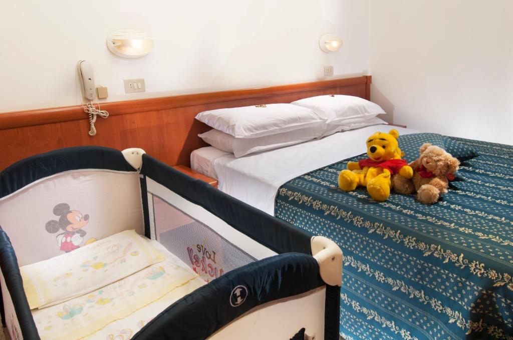 Postel nebo postele na pokoji v ubytování Hotel caesar