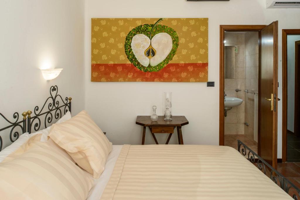 Postel nebo postele na pokoji v ubytování Hotel Porta Marmorea