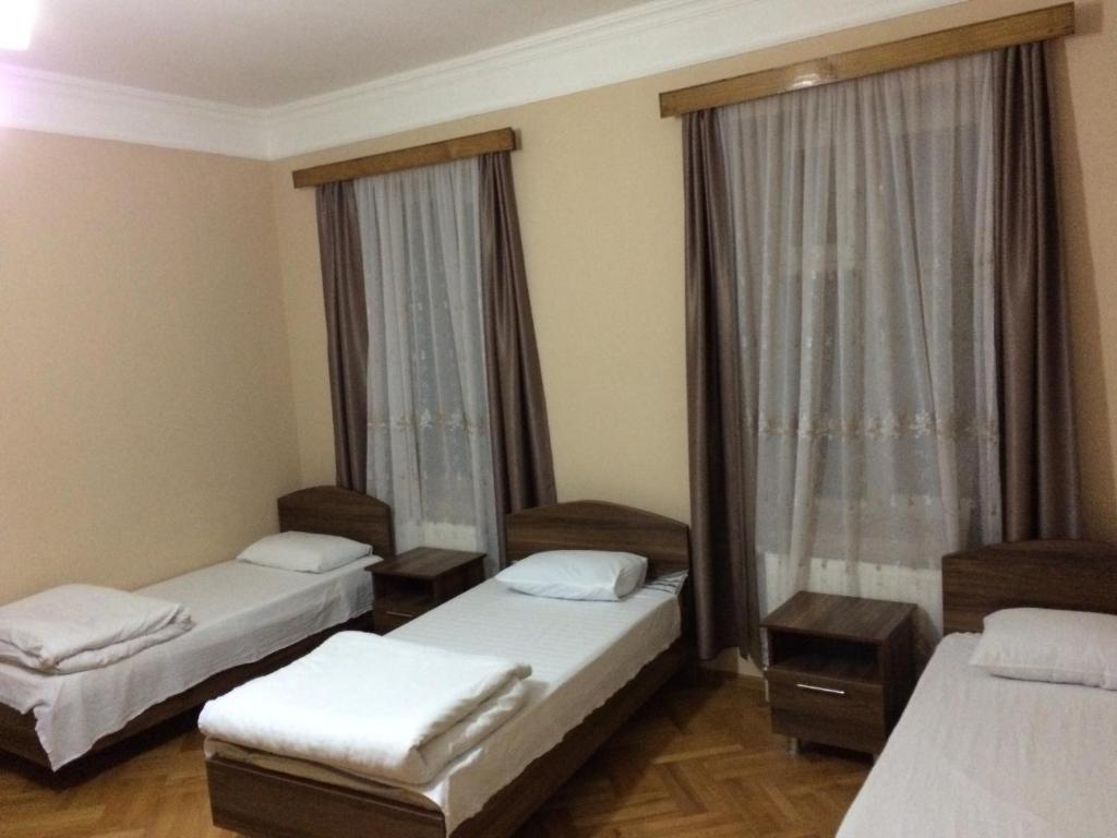 Postel nebo postele na pokoji v ubytování Mari Guest House