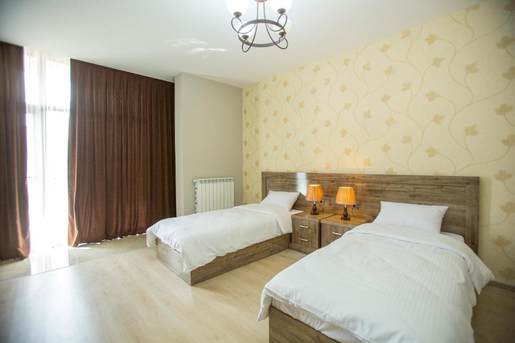 Postel nebo postele na pokoji v ubytování Ire Palace