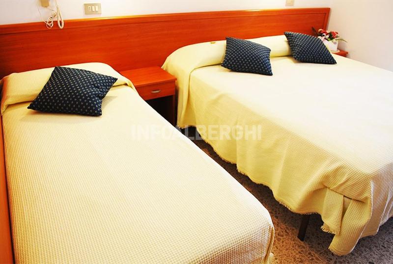 Postel nebo postele na pokoji v ubytování Hotel caesar