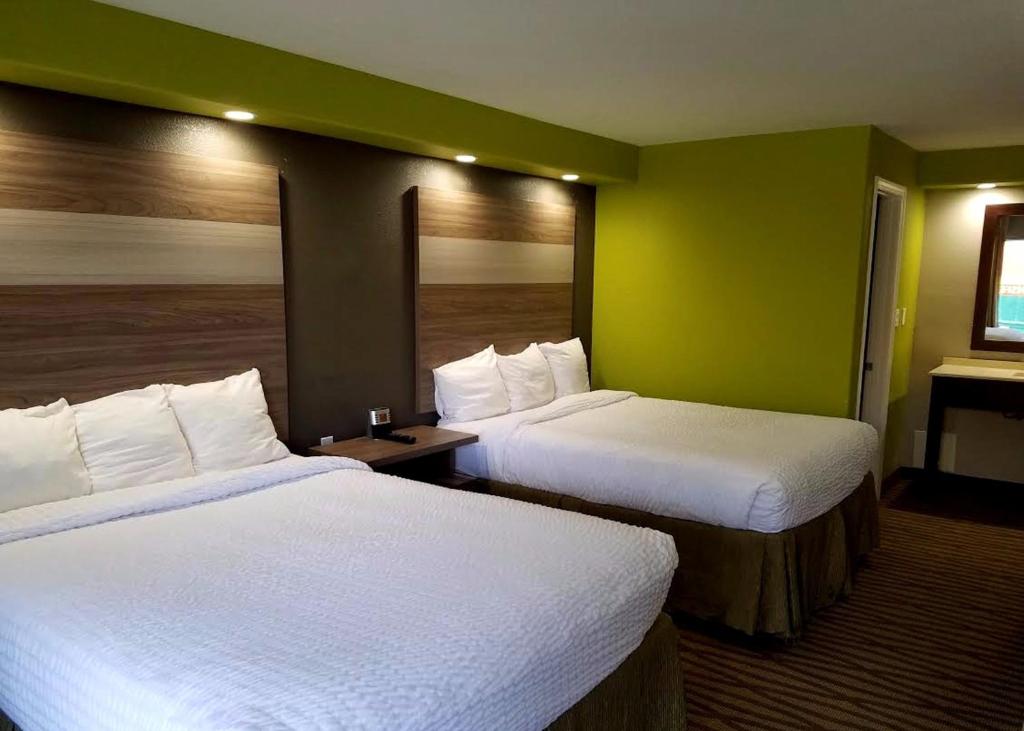 Postel nebo postele na pokoji v ubytování Seabreeze Inn - Fort Walton