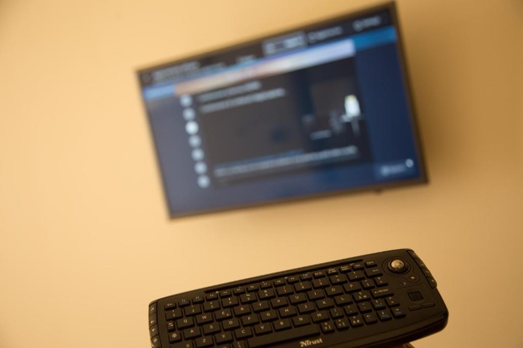 A television and/or entertainment centre at Antico Corso Charme