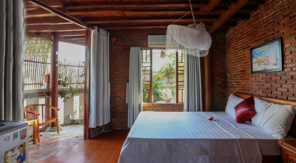 Postel nebo postele na pokoji v ubytování Seaside An Bang Homestay