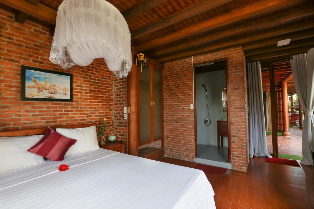 Postel nebo postele na pokoji v ubytování Seaside An Bang Homestay