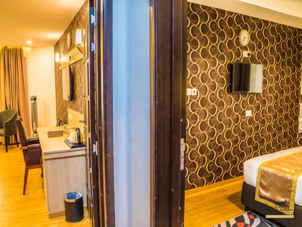 Postel nebo postele na pokoji v ubytování The Ole-Ken Hotel