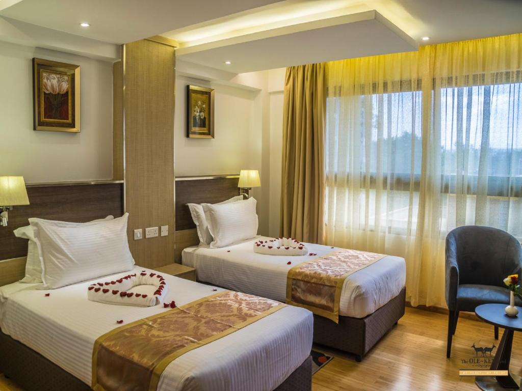 Postel nebo postele na pokoji v ubytování The Ole-Ken Hotel