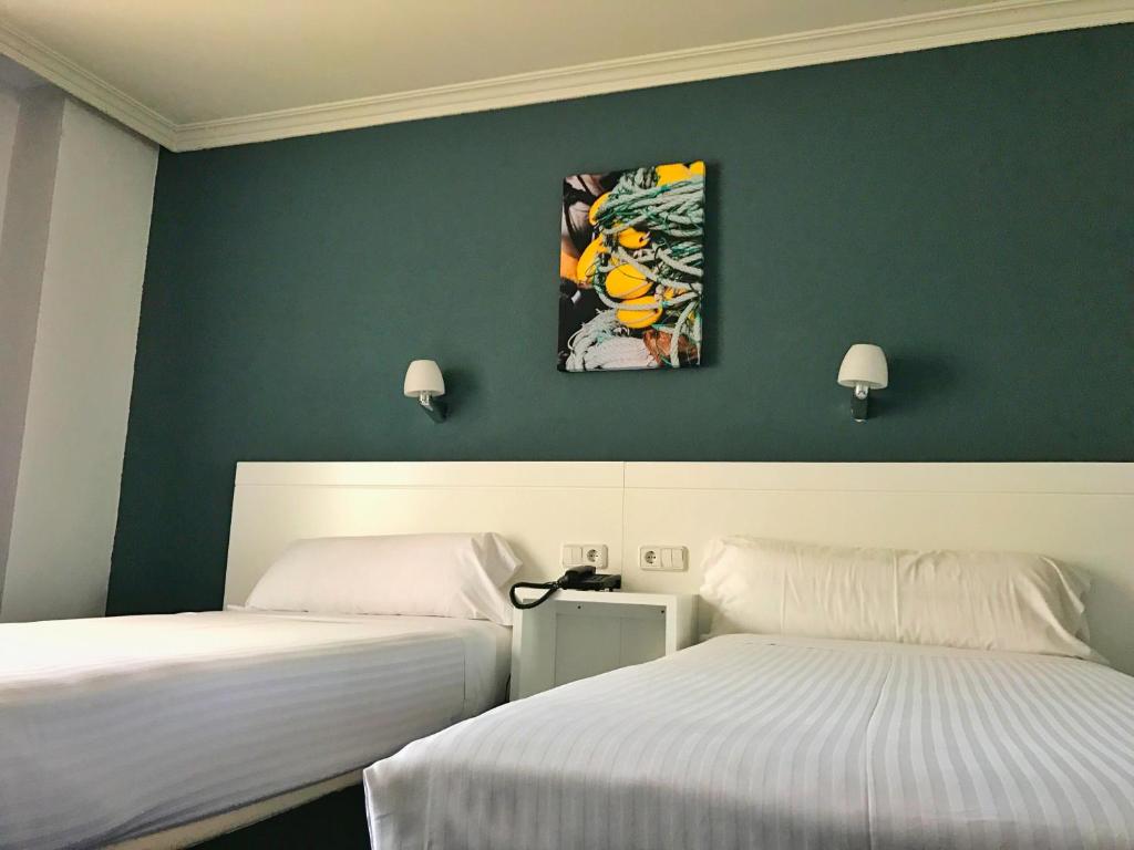 Postel nebo postele na pokoji v ubytování Hotel Gran Regente