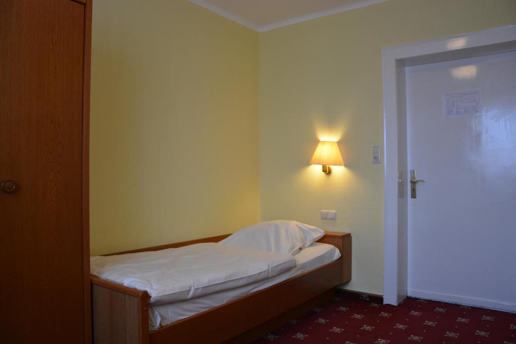 Postel nebo postele na pokoji v ubytování Hotel Meyn