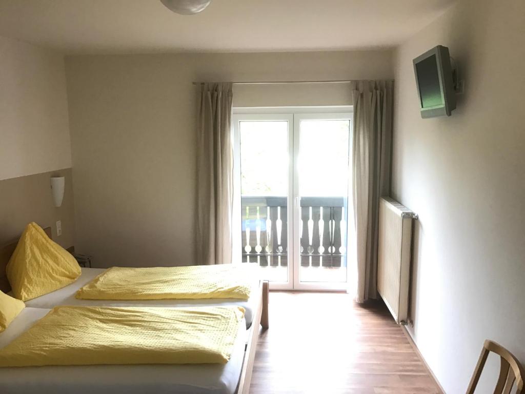 Postel nebo postele na pokoji v ubytování Gasthof Röck