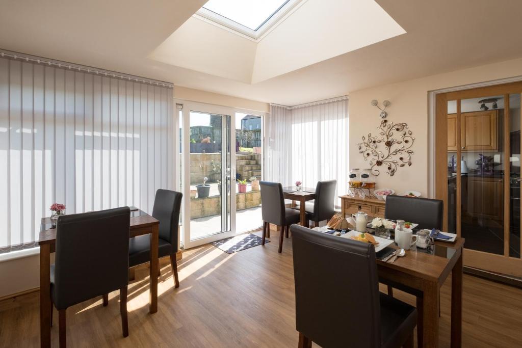 a dining room with a table and chairs at Lazy Days in Whitby