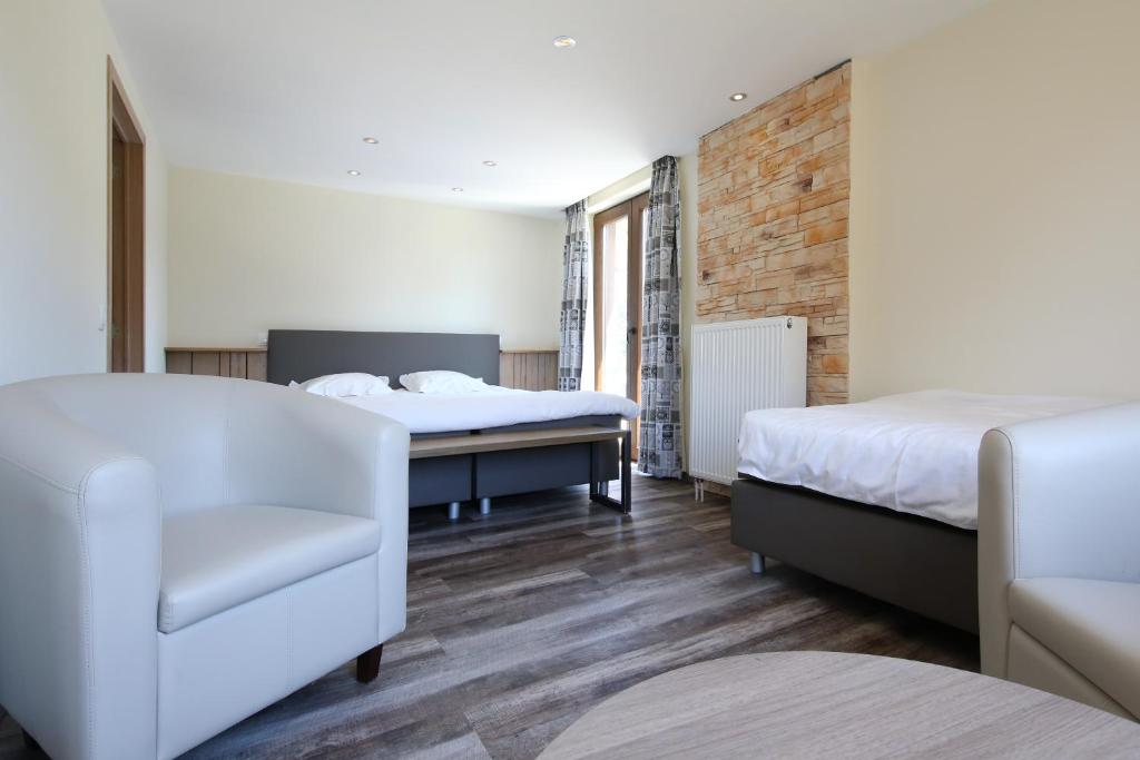 Postel nebo postele na pokoji v ubytování Hotel Val De La Cascade