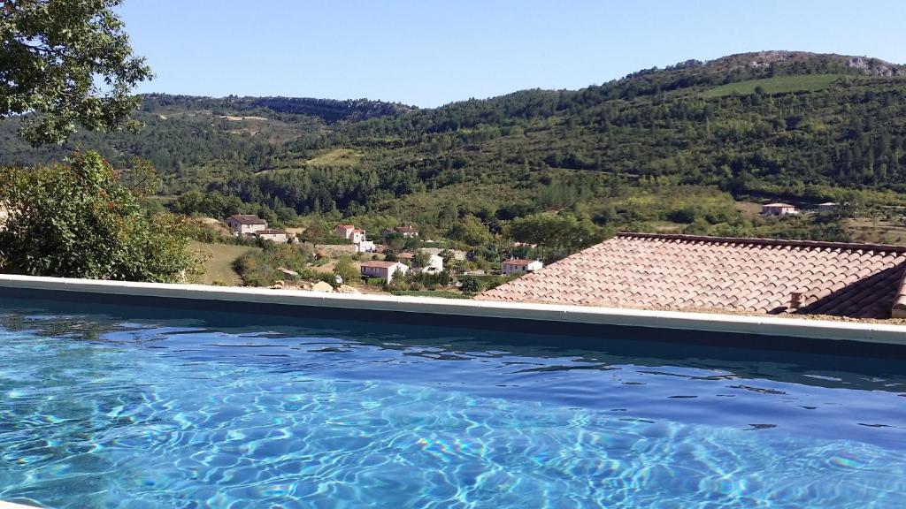 a swimming pool with a view of a mountain at Chemin Du Soula in Couiza