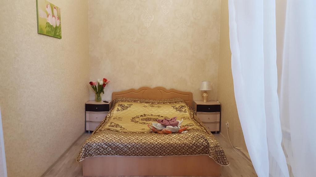 Uma cama ou camas num quarto em Apartment Первомайский 7