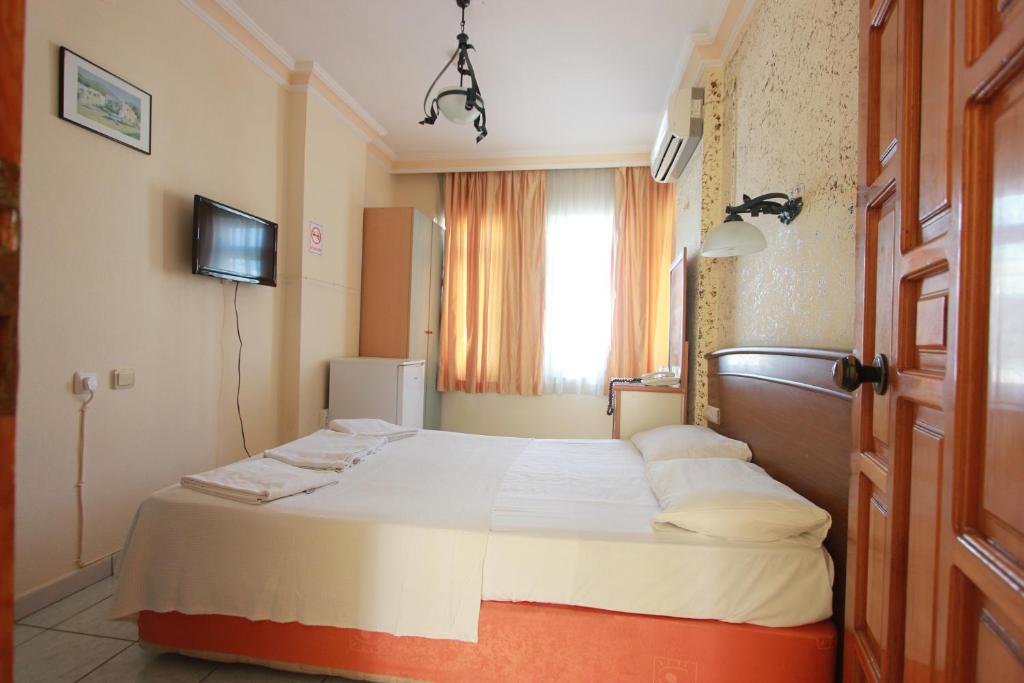 Postel nebo postele na pokoji v ubytování Baronessa Apart Hotel