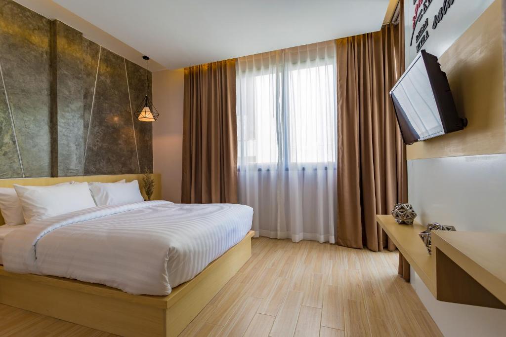 TV a/nebo společenská místnost v ubytování OneLoft Hotel