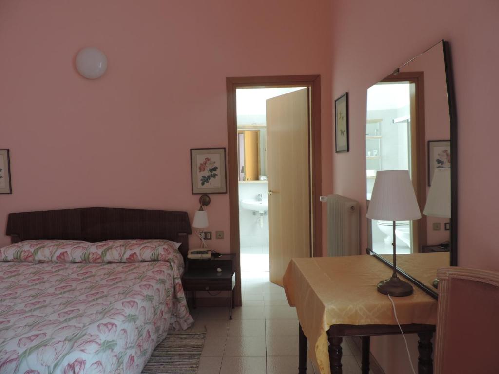 Postel nebo postele na pokoji v ubytování Hotel Vapore