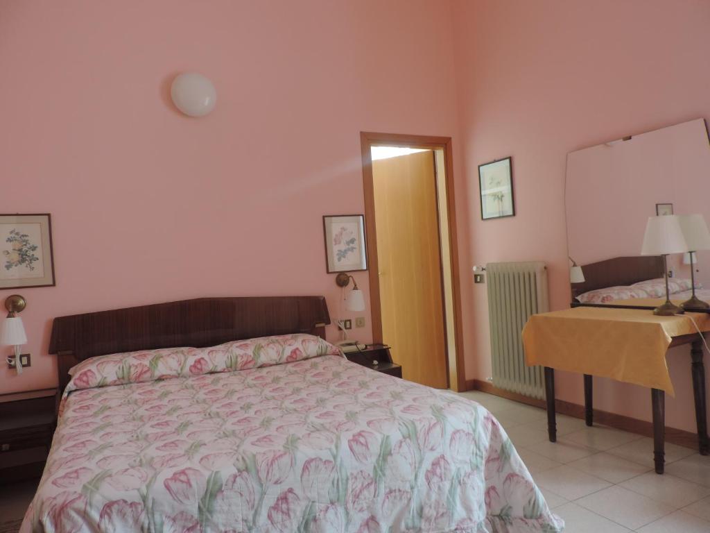 Postel nebo postele na pokoji v ubytování Hotel Vapore