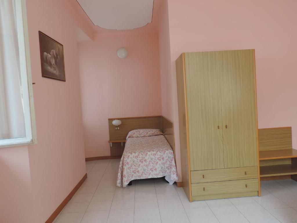 Postel nebo postele na pokoji v ubytování Hotel Vapore