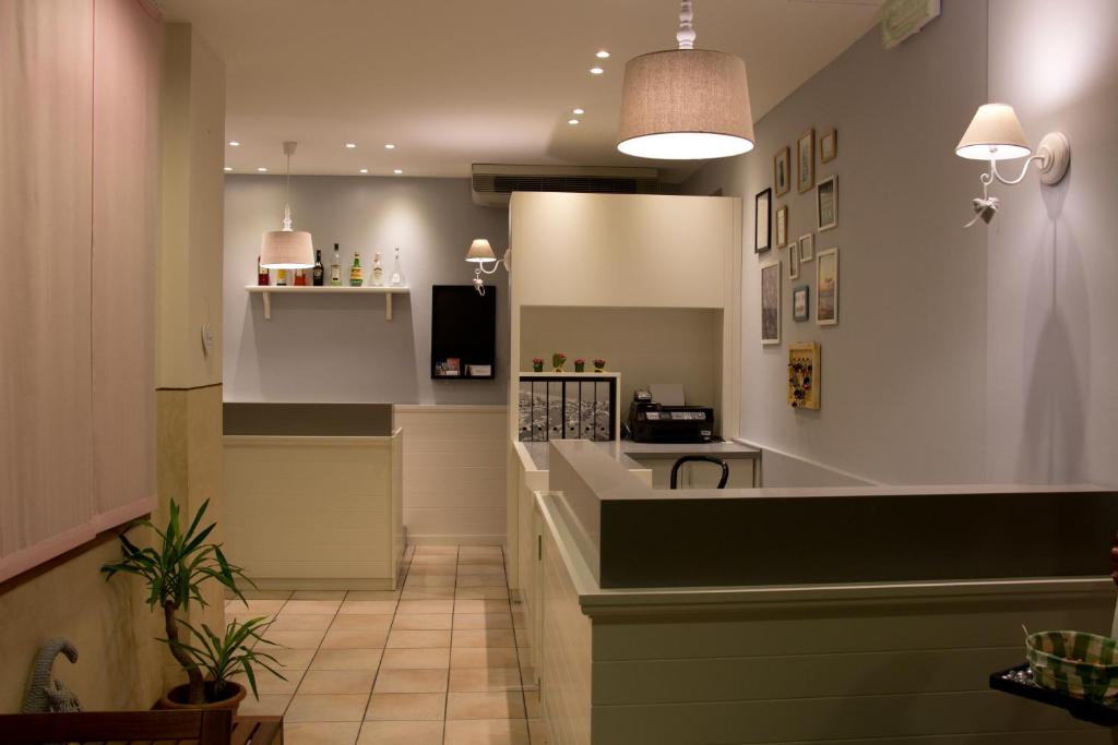 a kitchen with a counter in a room at Hotel Jolie in Riccione