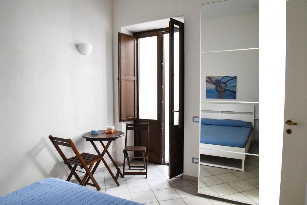 A bed or beds in a room at Venti di Mare