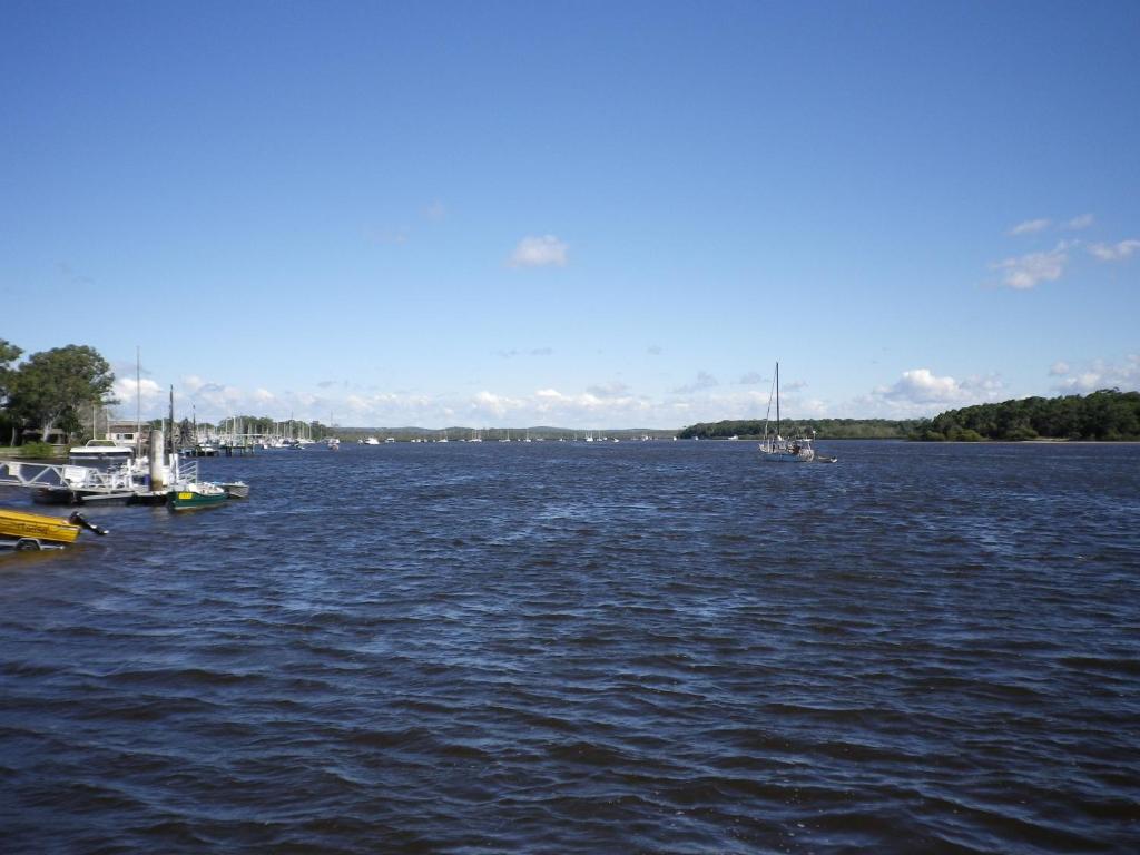a large body of water with boats in it at Tin Can Bay's Sleepy Lagoon Motel in Tin Can Bay