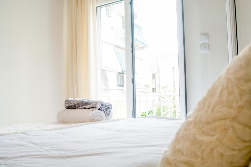 Ένα ή περισσότερα κρεβάτια σε δωμάτιο στο Central Cozy Flat