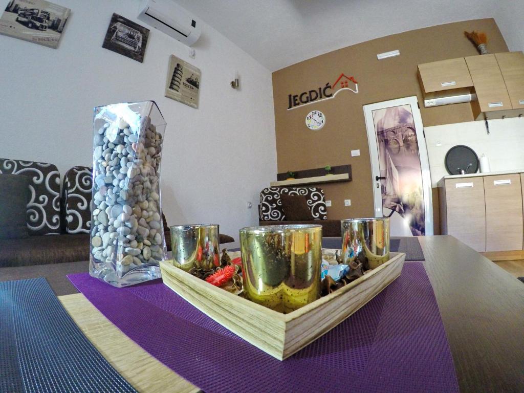 a table with a tray of food on a table at Studio Jegdic in Trebinje
