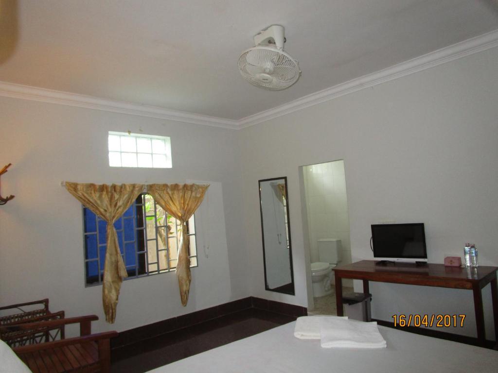 Postel nebo postele na pokoji v ubytování Visal Sak Guesthouse