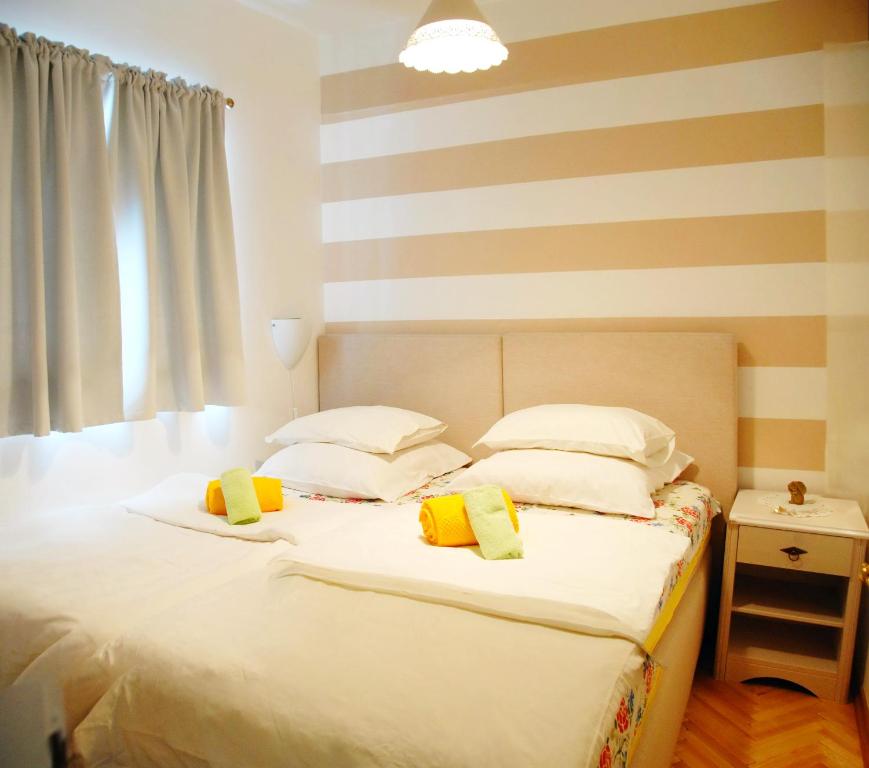 Postel nebo postele na pokoji v ubytování Apartments Inspiration