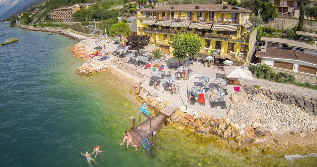 an aerial view of a resort on the water at Taki Village in Brenzone sul Garda