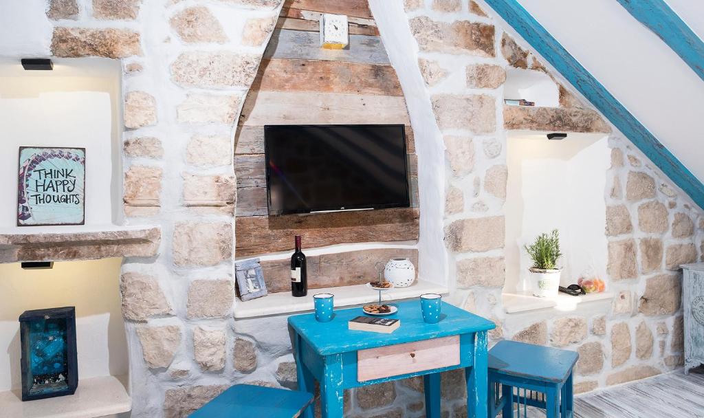 Een TV en/of entertainmentcenter bij Guesthouse Rustico
