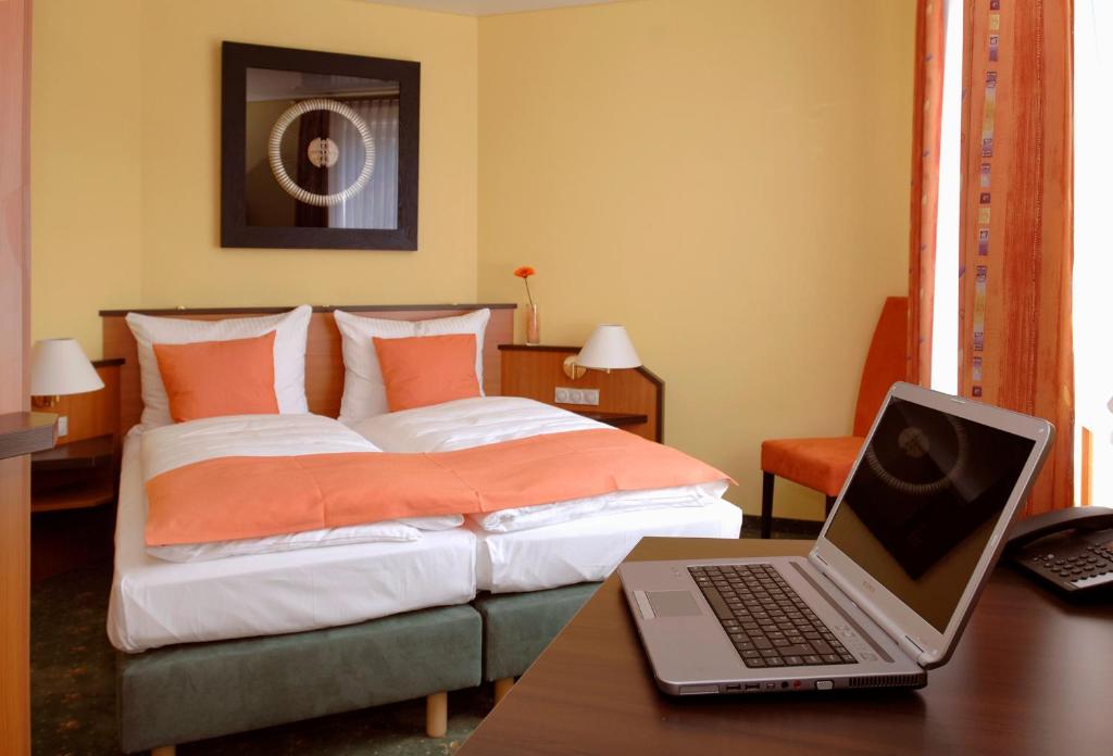 Postel nebo postele na pokoji v ubytování Hotel Sperling mit E-Ladestation