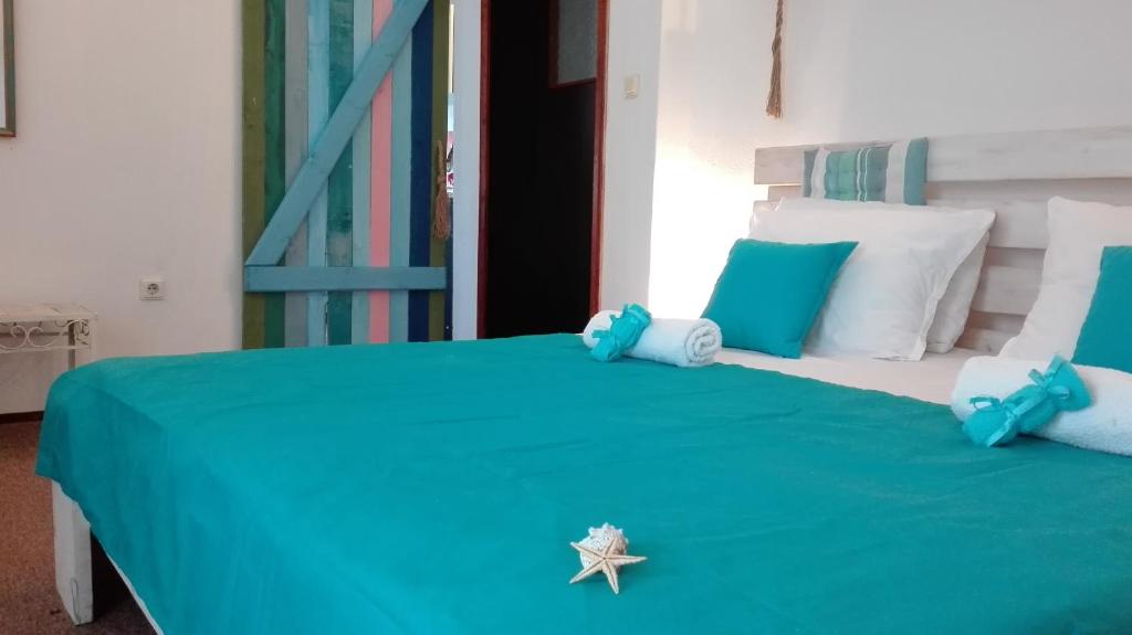 Postel nebo postele na pokoji v ubytování Rali Apartments