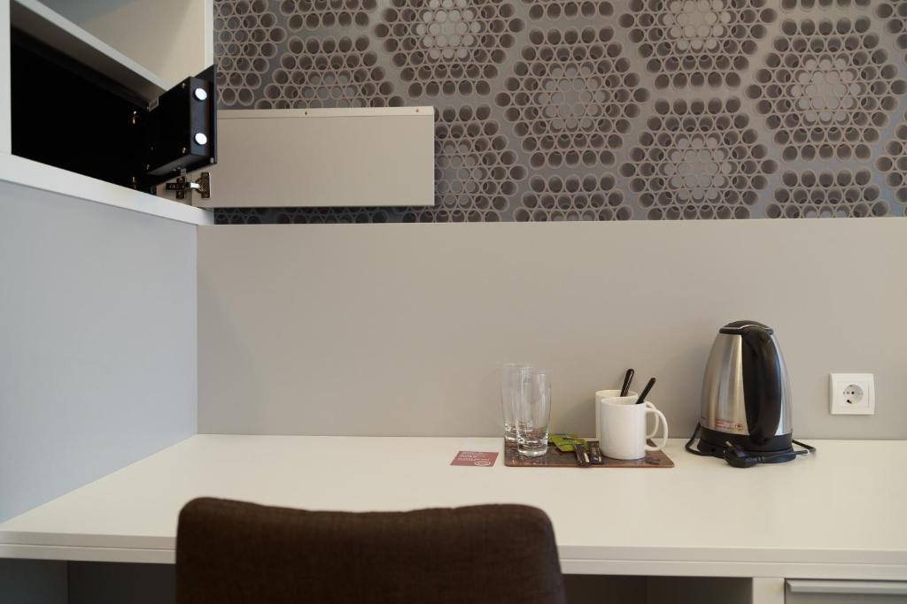 Kuchyň nebo kuchyňský kout v ubytování Hotel Mika Downtown