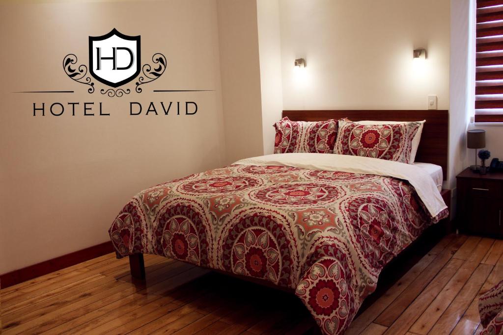 Postel nebo postele na pokoji v ubytování Hotel David