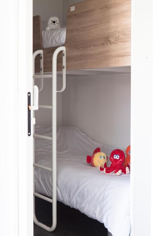 Postel nebo postele na pokoji v ubytování Strand49 Glamping Sint Maartenszee