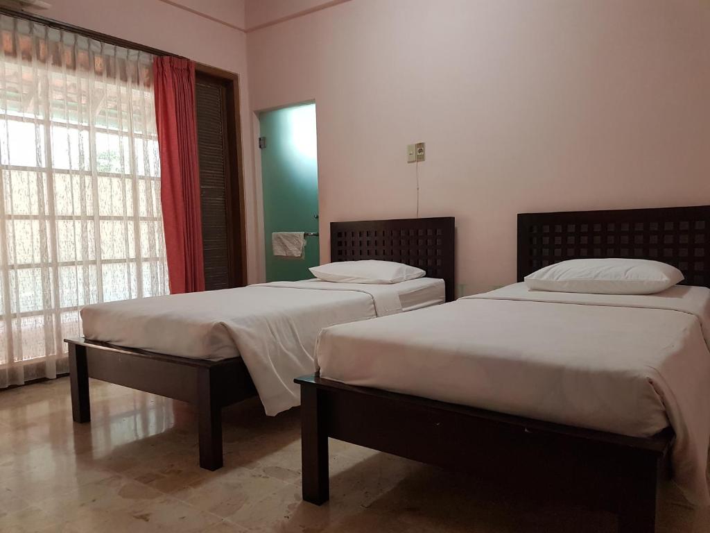 Postel nebo postele na pokoji v ubytování Peye Guesthouse