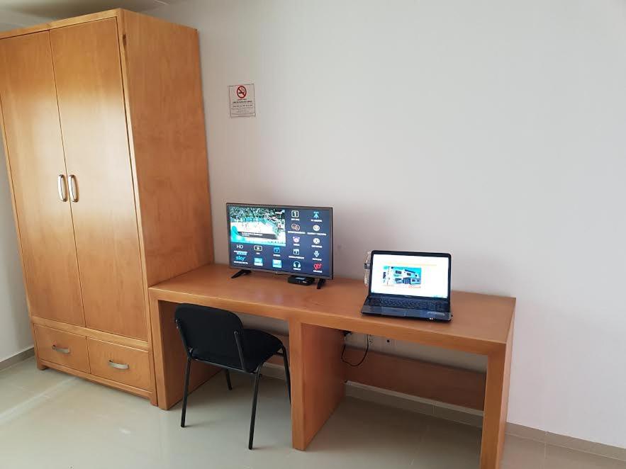 TV a/nebo společenská místnost v ubytování Casa RyS Hotel