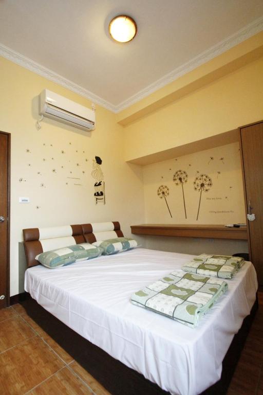 Postel nebo postele na pokoji v ubytování 驫風民宿 Equuleus Homestay
