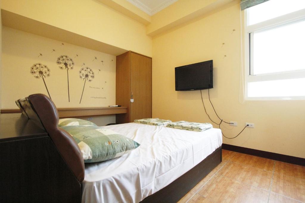 Postel nebo postele na pokoji v ubytování 驫風民宿 Equuleus Homestay