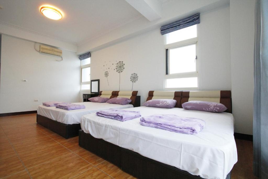 Postel nebo postele na pokoji v ubytování 驫風民宿 Equuleus Homestay