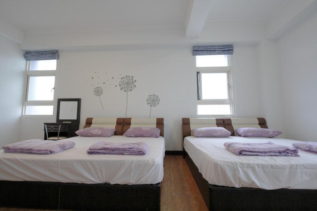 Postel nebo postele na pokoji v ubytování 驫風民宿 Equuleus Homestay