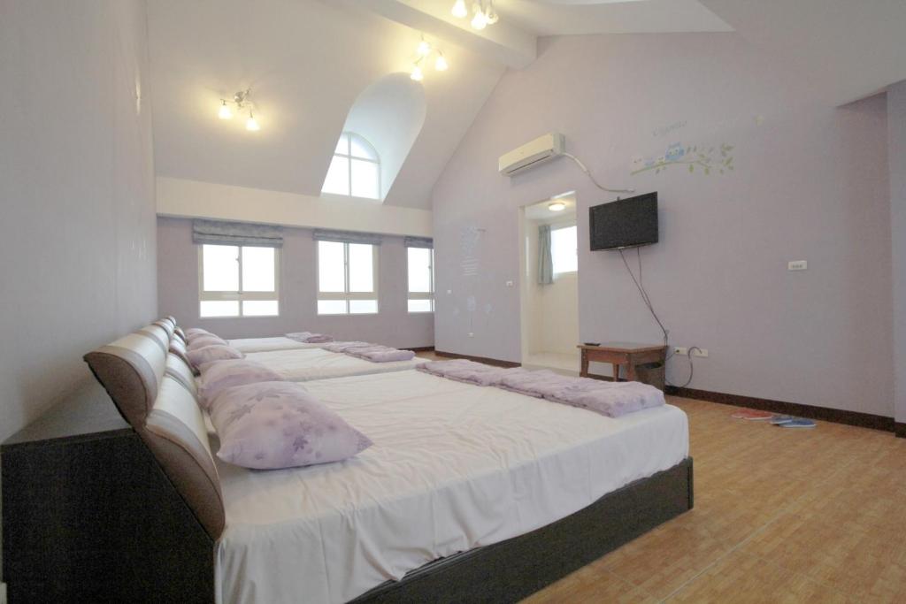 Postel nebo postele na pokoji v ubytování 驫風民宿 Equuleus Homestay