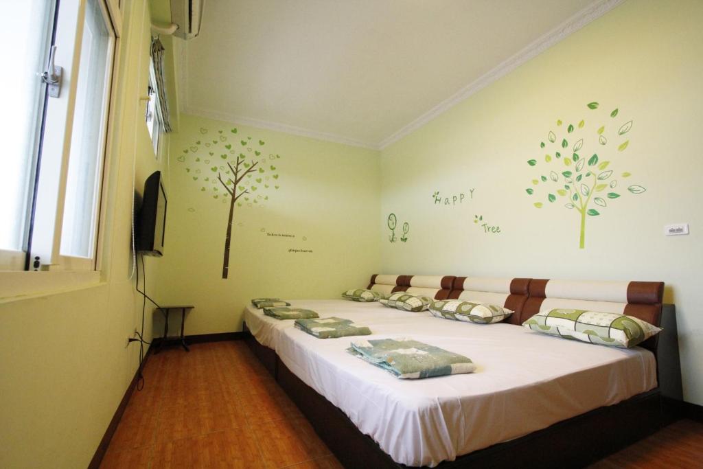 Postel nebo postele na pokoji v ubytování 驫風民宿 Equuleus Homestay