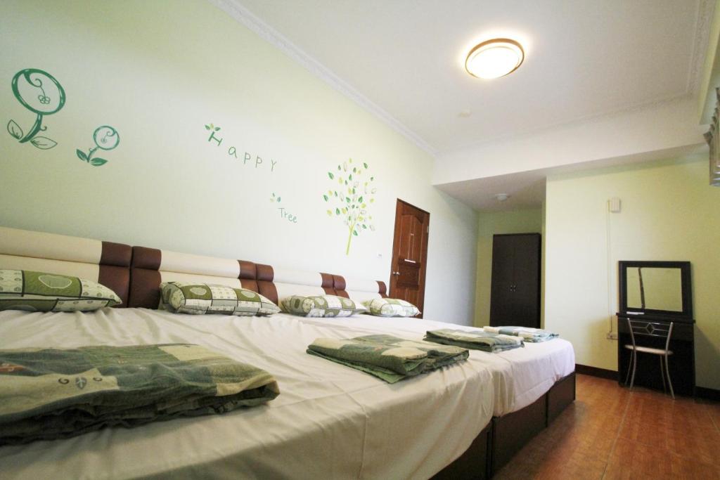 Postel nebo postele na pokoji v ubytování 驫風民宿 Equuleus Homestay