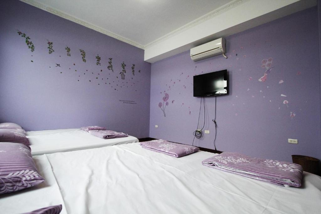 Postel nebo postele na pokoji v ubytování 驫風民宿 Equuleus Homestay