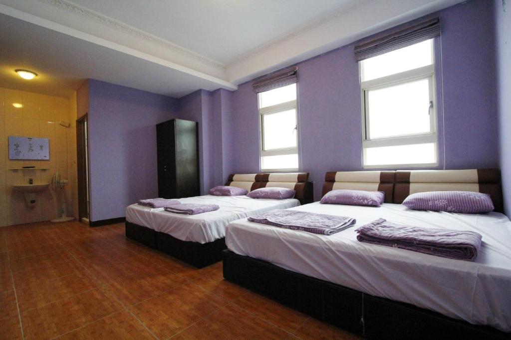 Postel nebo postele na pokoji v ubytování 驫風民宿 Equuleus Homestay