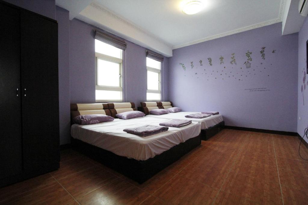 Postel nebo postele na pokoji v ubytování 驫風民宿 Equuleus Homestay
